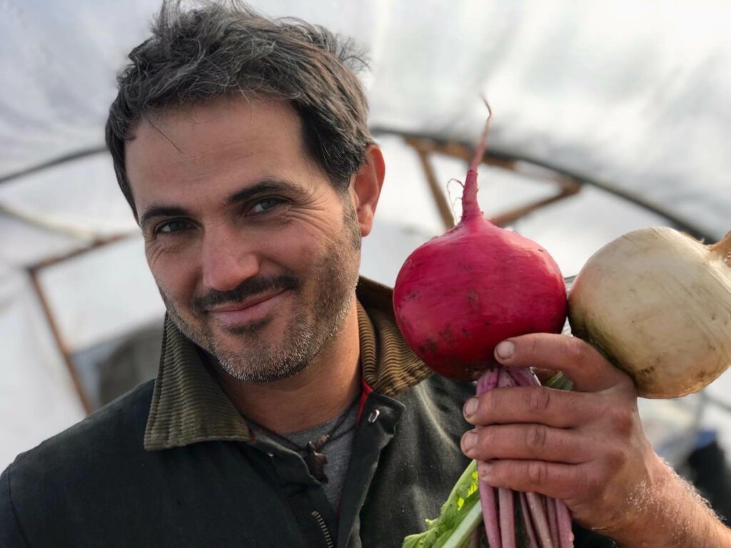 Farmer holding fresh produce