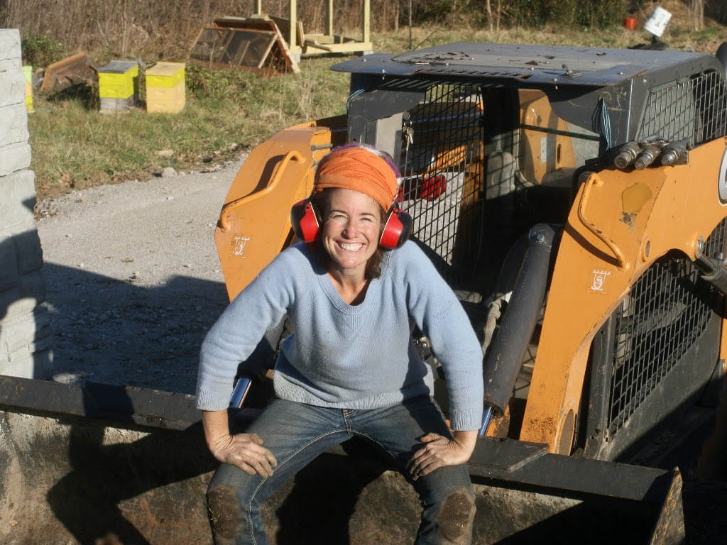 Woman smiling on forklift