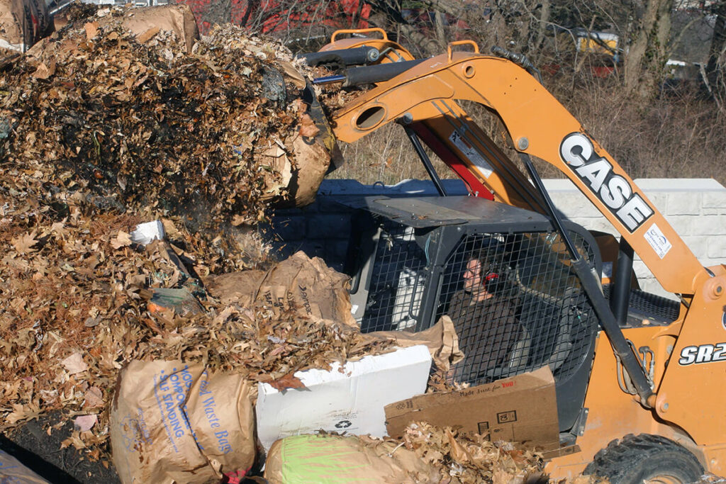 Forklift turning compost